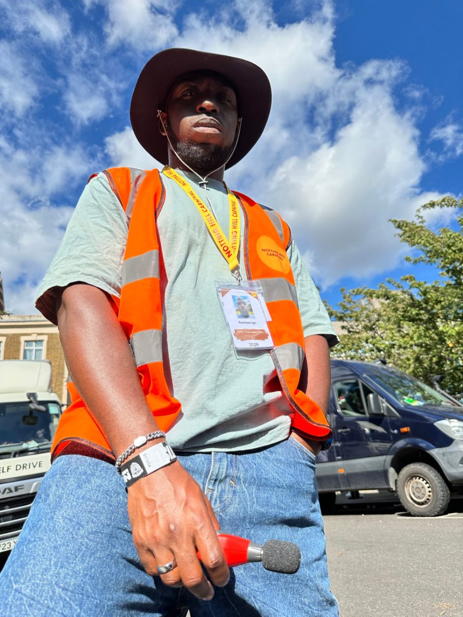 Rasheed in a hi-vis Notting Hill Carnival vest with his 2026 crowd safety team pass